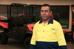 man in front of forklift